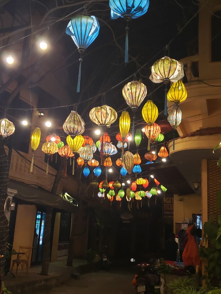 Silk lanterns strung over a Hoi An street at night